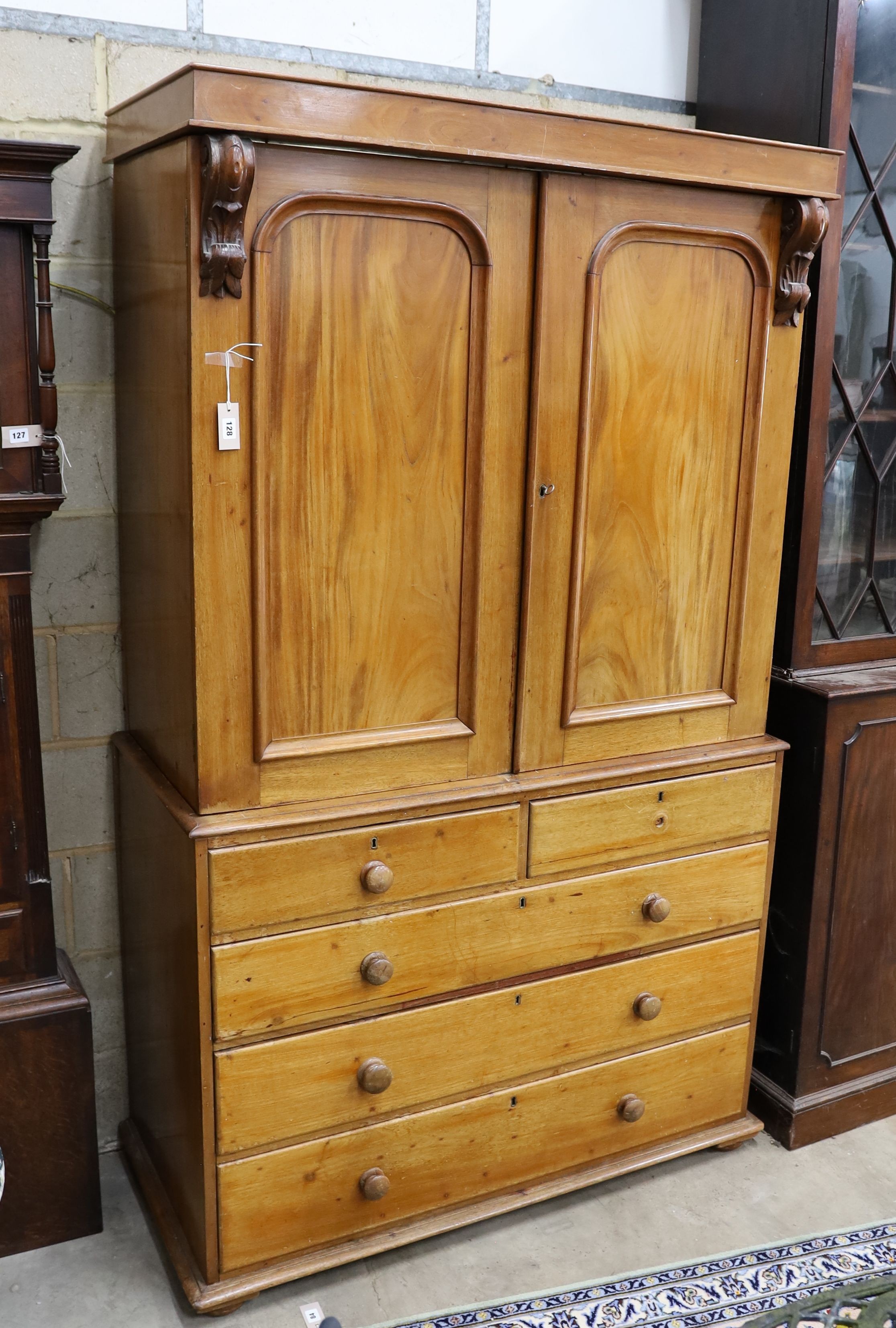 A Victorian satin walnut press cupboard, fitted a pair of doors over two drawers and three long drawers on plinth base, width 124cm, depth 56cm, height 210cm